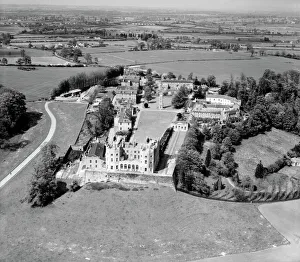 <b class=qtipBold><figcaption>Stoke Park Colony EAW005368</figcaption></b><br>The Stoke Park Colony (Stoke Park Hospital), Stoke Gifford, near Bristol, South Gloucestershire, 13th May 1947. The, now yellow, Dower House, situated on the balustraded terrace, remains a prominent landmark. Aerofilms Collection.<br><em>© Historic England</em> Stoke Park Colony EAW005368
