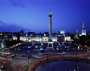 <b class=qtipBold><figcaption>Trafalgar Square J060221</figcaption></b><br>TRAFALGAR SQUARE, City of Westminster, London. Elevated view of the square showing Nelson's Column & National Gallery at night.<br><em>© Historic England</em> Trafalgar Square J060221