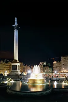 <b class=qtipBold><figcaption>Trafalgar Square K980144</figcaption></b><br>TRAFALGAR SQUARE, London. Night view of the square showing floodlit fountain and Nelson's Column.<br><em>© Historic England</em> Trafalgar Square K980144