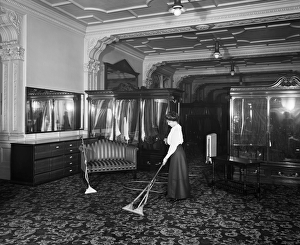 <b class=qtipBold><figcaption>Vacuum cleaning 1910 BL21028</figcaption></b><br>FREDERICK GORRINGE'S DEPARTMENT STORE, 75 Buckingham Palace Road, London. Interior view. A lady demonstrating the latest in vacuum cleaning technology. Gorringe's had opened in the 1900s, finally closing its doors in the 1960s. Photographed by Bedford Lemere & Co in 1910.<br><em>© Historic England</em> Vacuum cleaning 1910 BL21028