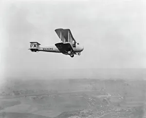 <b class=qtipBold><figcaption>Vickers aircraft EPW001728</figcaption></b><br>Aerial view of what appears to be a Vickers Vimy Commercial aircraft in flight (with the unusual registration 17-X on the tail fin). The same basic airframe was used for the Vickers Vernon, adopted by the RAF as a cargo aircraft between 1921 and 1927. Photographed here in 1920, around the time of the first aerial Pageant at Hendon (July 3rd 1920). Aerofilms Collection (see Links).<br><em>© Historic England</em> Vickers aircraft EPW001728