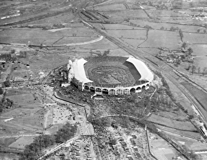 <b class=qtipBold><figcaption>Wembley Cup Final 1923 EPW008545</figcaption></b><br>WEMBLEY STADIUM, London. The first Wembley FA Cup Final was marked by disorderly scenes. Before the match a massive crowd outside the stadium rushed the gates, burst the barriers and swarmed on to the pitch. Kick-off was delayed for 45 minutes as mounted police encouraged people to move behind the touchlines. It was estimated that 200, 000 fans had squeezed into Wembley. Bolton beat West Ham 2-0. Aerial photograph taken on 28th April 1923 (taken from a copy negative). Aerofilms Collection (see Links).<br><em>© Historic England Aeroflims Collection</em> Wembley Cup Final 1923 EPW008545