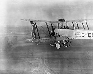 <b class=qtipBold><figcaption>Wing walking EPW037626</figcaption></b><br>Wing walking without a harness on an Aviation Tours Ltd Avro 504K. Photographed in April 1932. Some damage on negative - produced from copy negative. Aerofilms Collection (see Links).<br><em>© Historic England</em> Wing walking EPW037626
