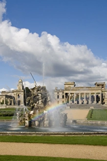 <b class=qtipBold><figcaption>Witley Court Fountain N071286</figcaption></b><br>WITLEY COURT AND GARDENS, Worcestershire. The house and Perseus and Andromeda Fountain with a rainbow amid the water spouts.<br><em>© Historic England</em> Witley Court Fountain N071286