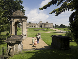 <b class=qtipBold><figcaption>Witley Court and Gardens N071273</figcaption></b><br>WITLEY COURT AND GARDENS, Worcestershire. Visitors in the grounds walking towards the house and South Parterre. Domed pavilion to the left.<br><em>© Historic England</em> Witley Court and Gardens N071273