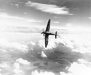 <b class=qtipBold><figcaption>Supermarine Spitfire XIV</figcaption></b><br>Supermarine Spitfire XIV (RB140) banking in flight<br><em>© Charles Brown Collection, Royal Air Force Museum</em> Supermarine Spitfire XIV