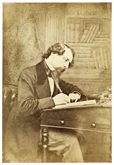<b class=qtipBold><figcaption>Charles Dickens</figcaption></b><br>CHARLES DICKENS English writer, at his writing desk, circa 1860<br><em>© Mary Evans Picture Library 2015 - https://copyrighthub.org/s0/hub1/creation/maryevans/MaryEvansPictureID/10013466</em> Charles Dickens
