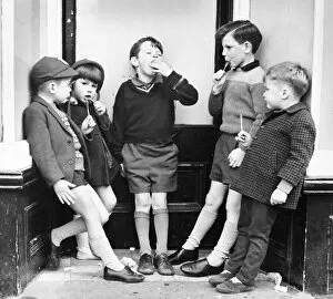 Eating Collection: Children with ice lollies on a Balham street, SW London