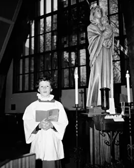 Candle Collection: Choirboy singing solo in a church, Horley, Surrey