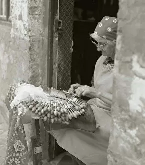 Door Way Collection: Elderly woman making lace in an open doorway