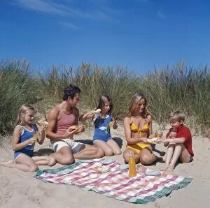 Enjoying Gallery: Family of five with picnic on beach
