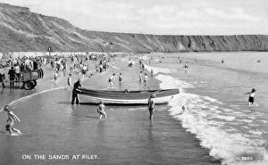 Resort Gallery: Holidaymakers on the sands at Filey, North Yorkshire