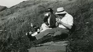 Enjoying Gallery: A late middle-aged couple enjoying a picnic
