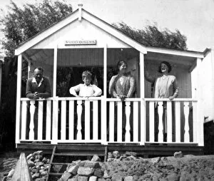 Enjoying Gallery: People in a typical beach hut or chalet, Walton, Essex