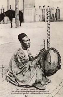 Seated Collection: Senegal - Griot playing a Kora