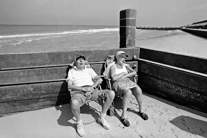 Enjoying Gallery: Sleeping pensioners, Norfolk beach