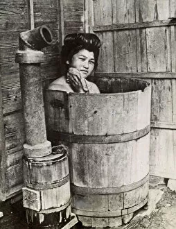 Seated Gallery: Traditional Japanese bathing in upright wooden tub