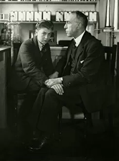 Seated Gallery: Willi Schneider when young seated with Harry Price