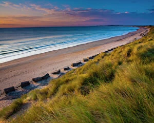 Sun Rise Gallery: England, Northumberland, Druridge Bay. A dramatic expanse of sand dunes fringing the picturesque beach at Druridge Bay