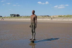 Full Body Gallery: One of the 100 men of Another Place, also known as The Iron Men, statues by Antony Gormley