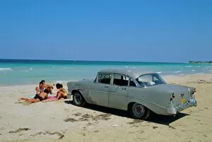 Leisure Time Collection: 1950s American car on the beach, Goanabo, Cuba, Caribbean Sea, Central America
