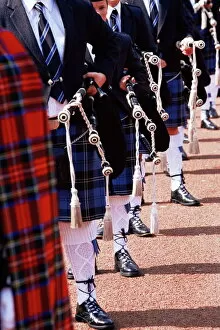 Musical Instrument Collection: Bagpipe players with traditional Scottish uniform