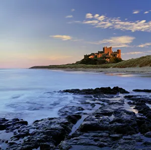Day Break Gallery: Bamburgh Castle bathed in warm evening light, Bamburgh, Northumberland