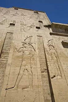 Tourist Attractions Gallery: Bas Relief of God Horus on the left, First Pylon, Temple of Horus, Edfu, Egypt