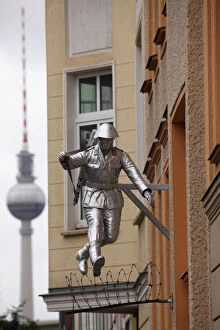 Freedom Collection: Berlin Television Tower (Fernsehturm) and sculpture of a soldier jumping the Berlin Wall at