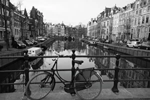 Dutch Gallery: Black and white imge of an old bicycle by the Singel canal, Amsterdam, Netherlands
