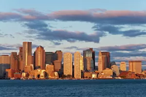 Day Break Gallery: City skline viewed across Boston harbour at dawn, Boston, Massachusetts