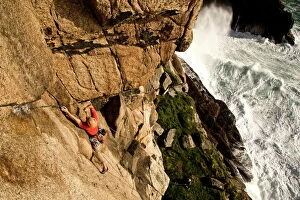 Freedom Collection: A climber on the classic extreme route Raven Wall on the cliffs at Bosigran, near St