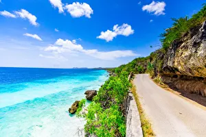 Netherlands Antilles Gallery: Crystal clear blue ocean side driving along the road on Bonaire, Netherlands Antilles