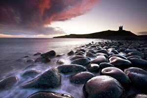 Day Break Gallery: Dawn over Embleton Bay with basalt boulders in the foreground