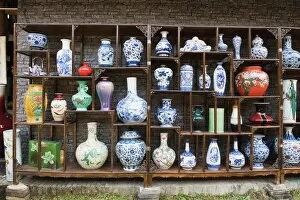 Intricate Gallery: A display of vases at the Qing and Ming Ancient Pottery Factory, Jingdezhen city