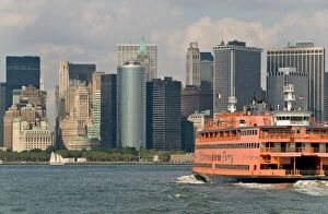 New York Collection: The famous orange Staten Island Ferry approaches lower Manhattan, New York