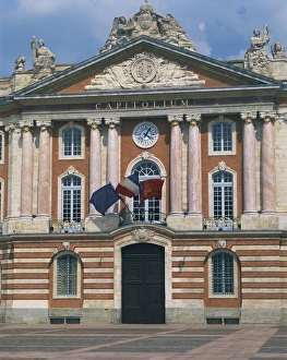 Civic Gallery: Flags flying below a clock on the Capitole building in Toulouse, Haute Garonne