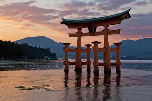Shrine Collection: The floating Miyajima torii gate of Itsukushima Shrine at sunset, UNESCO World Heritage Site