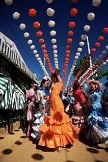 Full Body Gallery: Girls dancing a sevillana beneath colourful lanterns