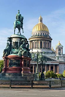 Golden dome of St. Isaacs Cathedral built in 1818 and the equestrian statue of Tsar