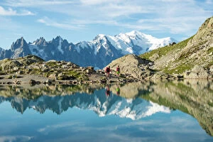 Getting Away From It All Gallery: Hikers and the summit of Mont Blanc reflected in Lac Blanc on the Tour du Mont Blanc