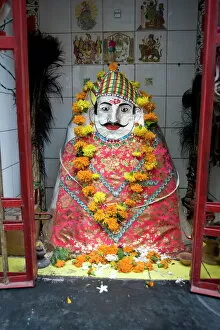 Shrine Gallery: Hindu street shrine, decorated with marigold mala (garlands) for Diwali festival