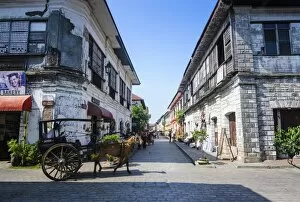 Horse cart riding through the Spanish colonial architecture in Vigan, UNESCO World Heritage Site, Northern Luzon