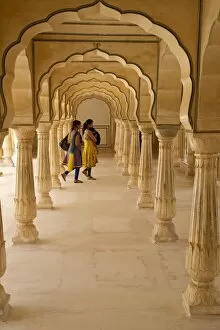 Indian Architecture Gallery: Indian women under arches, Amber Fort Palace, Jaipur, Rajasthan, India, Asia