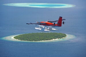 Getting Away From It All Gallery: Maldivian Air Taxi flying above island, Maldives, Indian Ocean, Asia