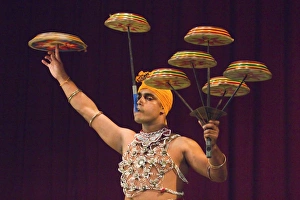 Man performing the Raban Dance and balancing drums in a tourist show at the Kandyan Arts Association Hall, Kandy, Sri Man performing the Raban Dance and balancing drums in a tourist show at the Kandyan Arts Association Hall, Kandy, Sri