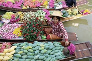 Seated Collection: Market trader in boat selling flowers and fruit