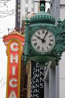 Editor's Picks: The Marshall Field Building Clock and Chicago Theatre behind, Chicago, Illinois