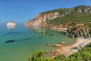 The sunset is reflected on the Beach of Masua, Iglesias