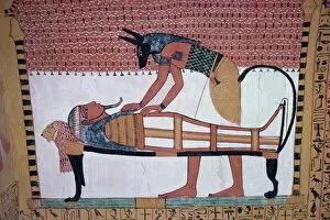 Egypt Collection: Mural showing the god Anubis leaning over mummy of Ramses II, in the Tomb of Sinjin